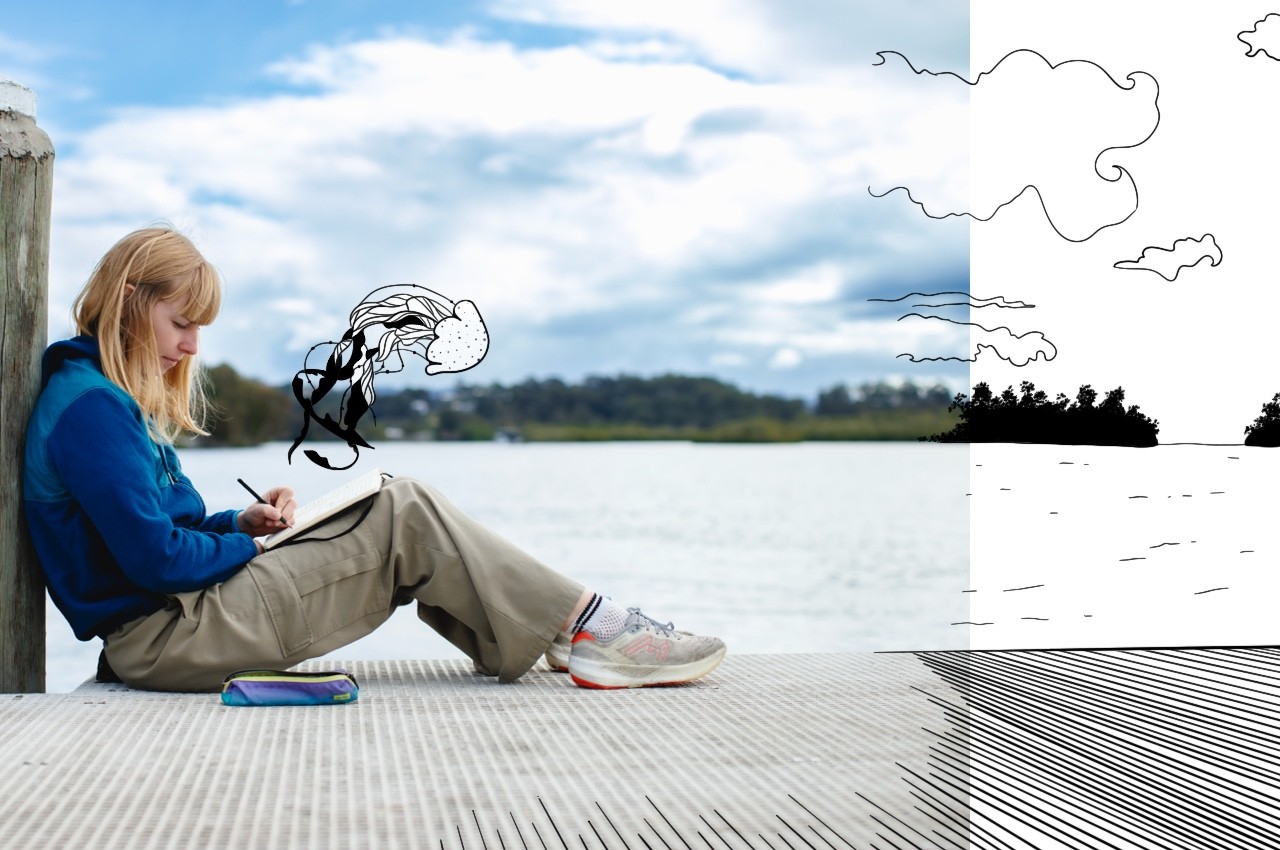 L'artiste Ewy dessinant au bord de l'eau